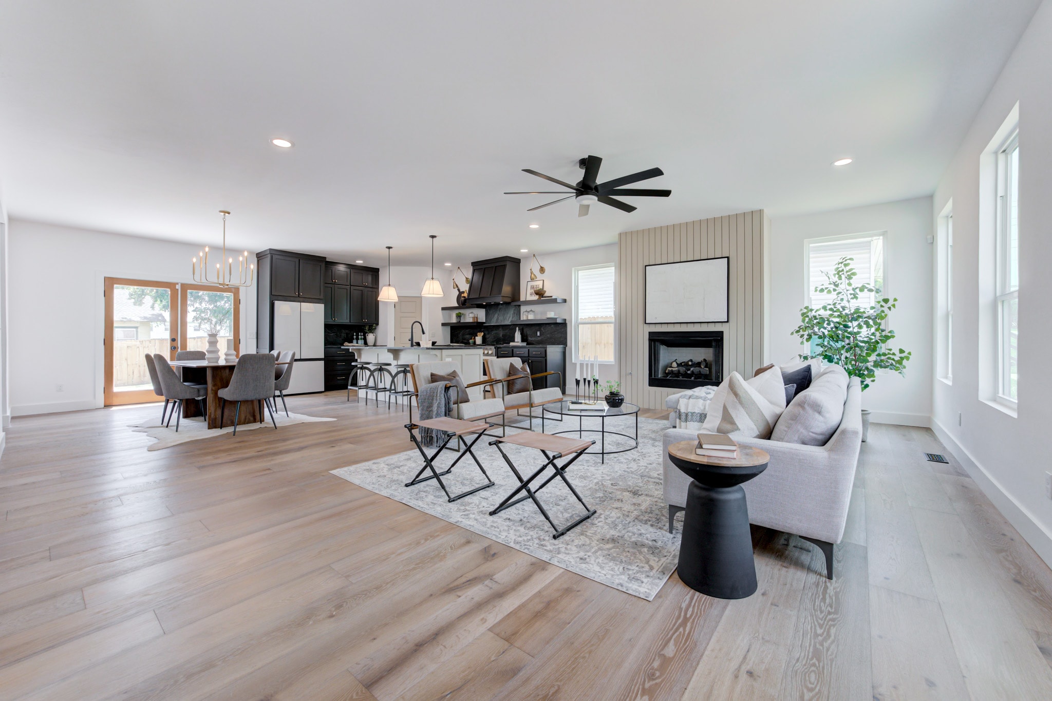 1014 NW 33rd St — open concept living dining and kitchen with black ceiling fan