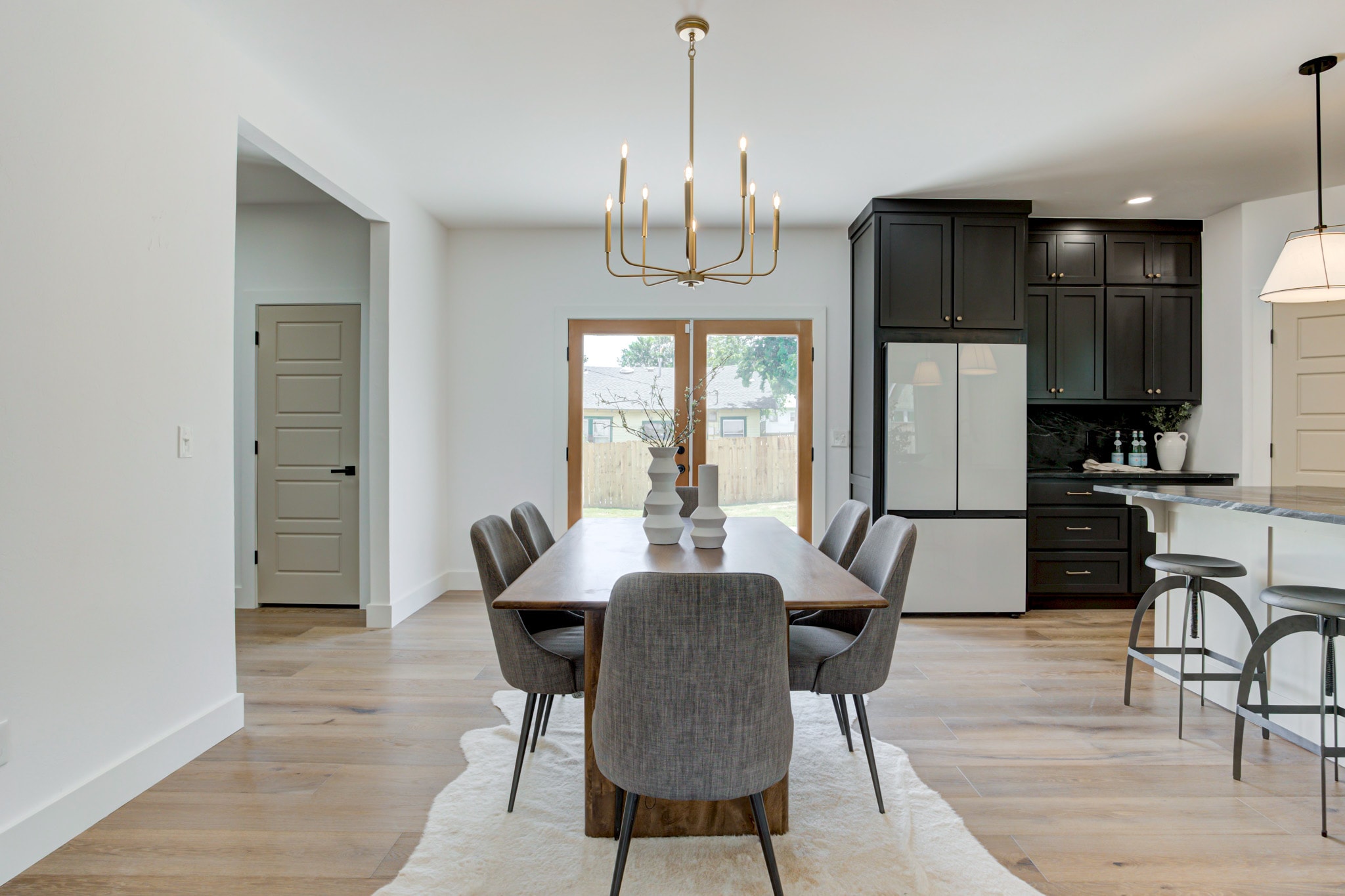 1014 NW 33rd St — dining room with walnut table and gold chandelier
