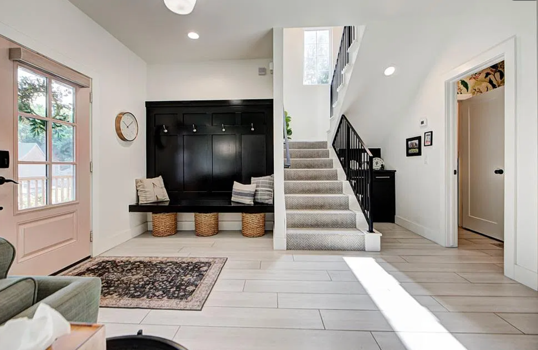 1124 NW 43rd St — open concept entry with black island and leather barstools