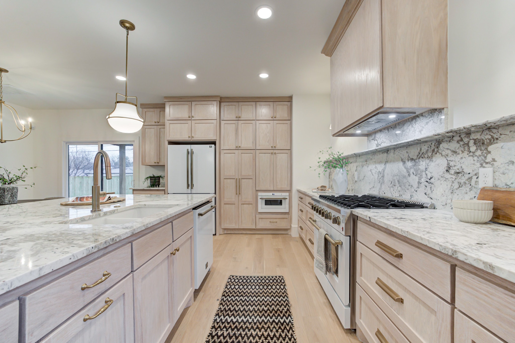 1128 NW 49th St kitchen with range and marble backsplash