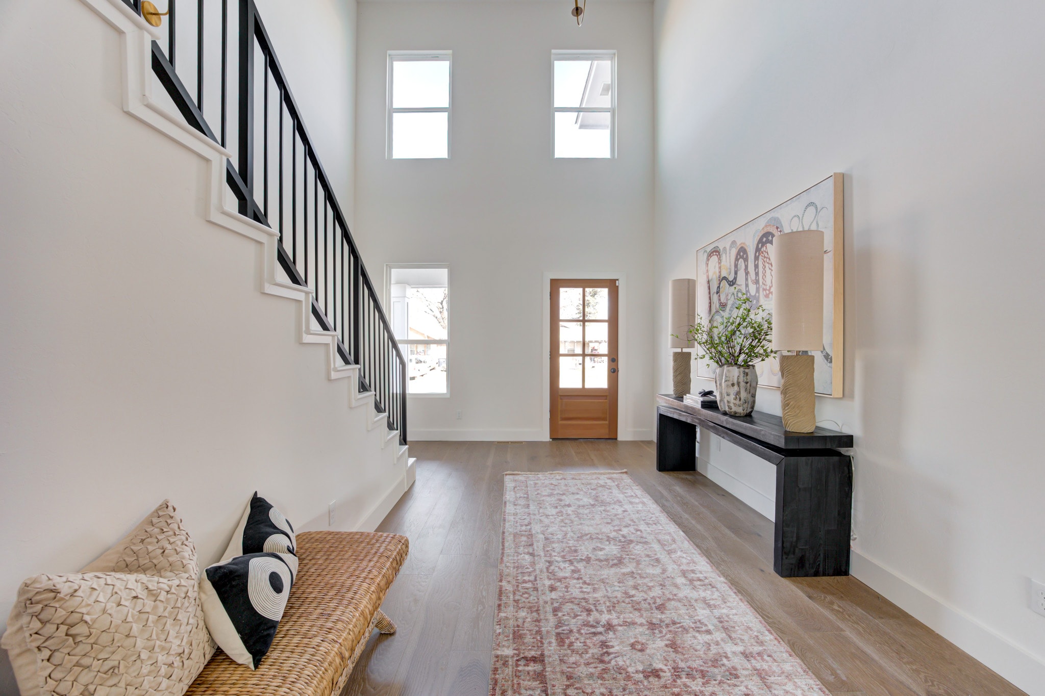 1840 NW 14th St — grand foyer with art wall and iron staircase