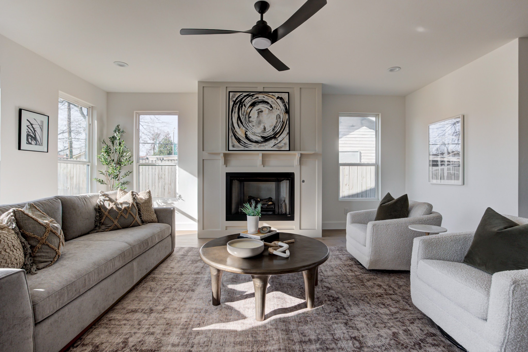 1840 NW 14th St — living room with fireplace and boucle chairs