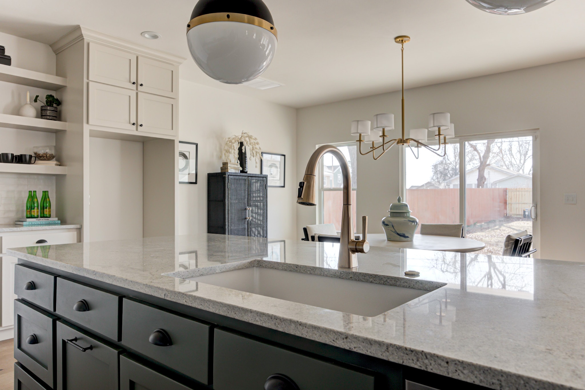 1840 NW 14th St — sage kitchen island close-up with bar stools